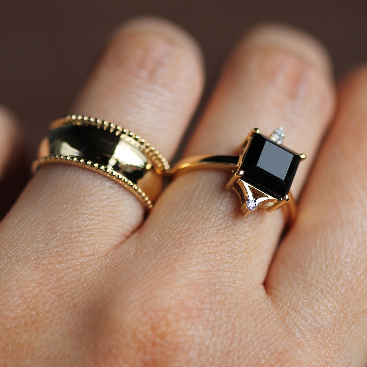 Gold rings with sales black stones