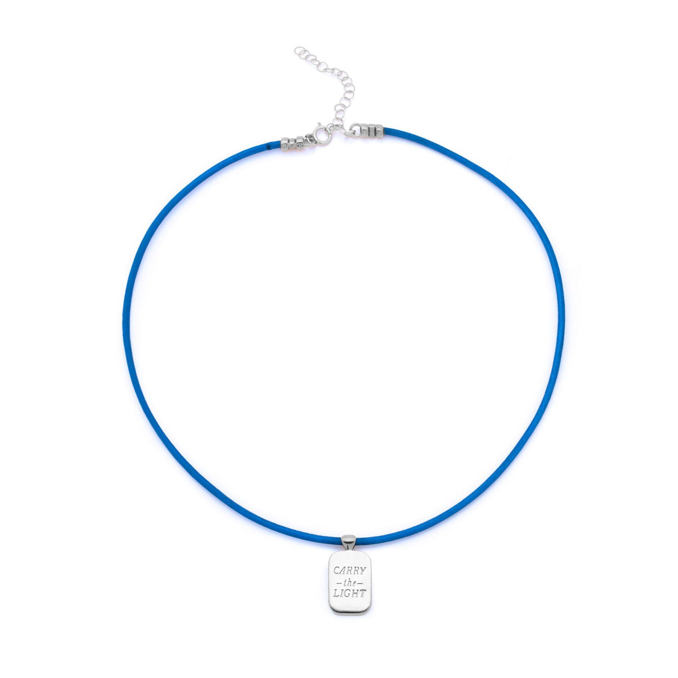 A blue cord necklace with a small silver rectangular pendant engraved with 'carry the light', displayed on a clean white background.
