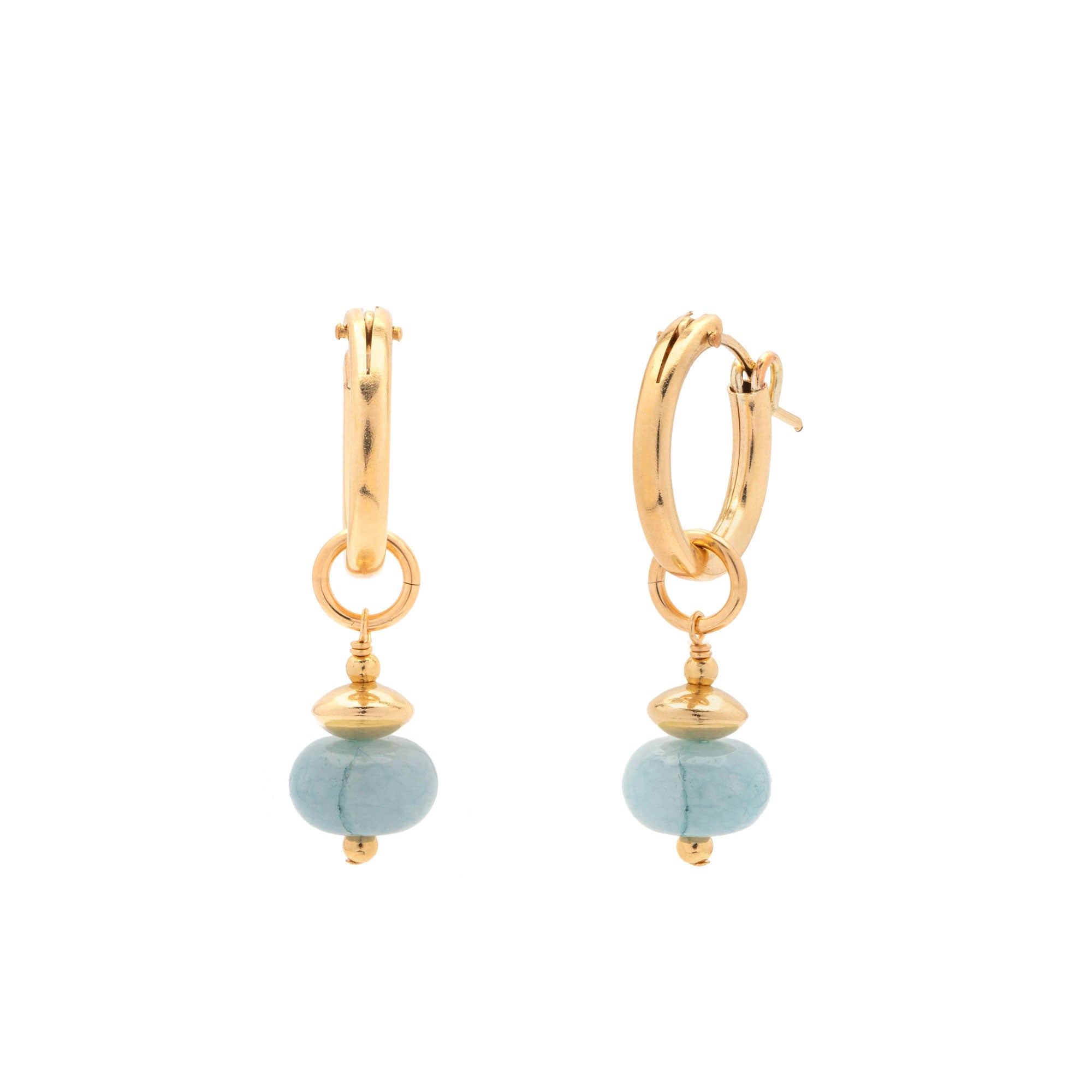 A pair of gold huggie hoop earrings with a dangling round light blue stone bead, shown on a plain white background.