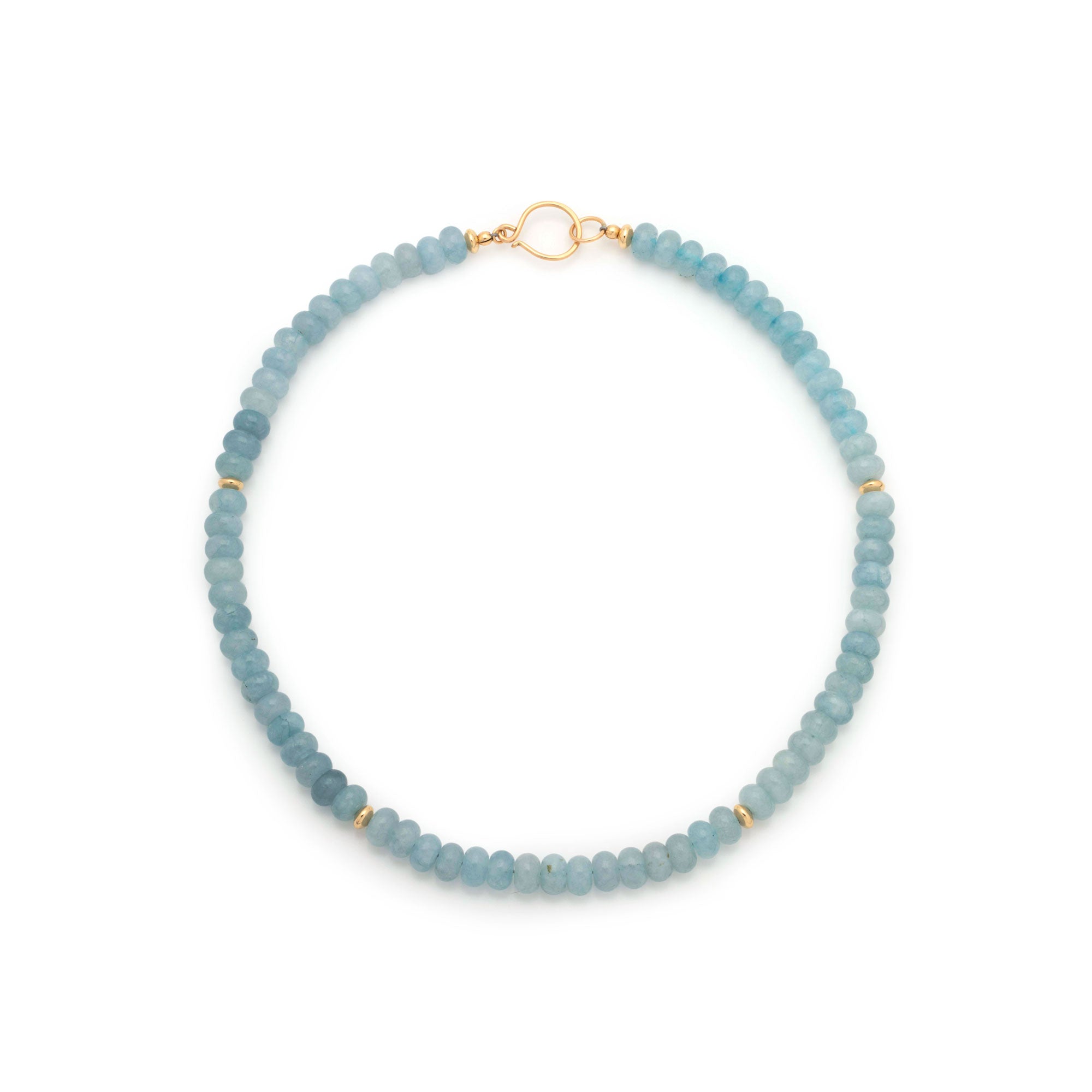 A beaded necklace made of light blue tumbled beads separated by small gold spacer rings, with a gold clasp, shown on a plain white background.